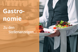 Waiter serving in motion on duty in restaurant. The waiter carri